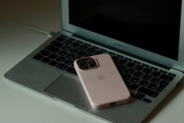 a%20cellphone%20with%20three%20built%20in%20lenses%20on%20an%20open%20laptop a%20cellphone%20with%20three%20built%20in%20lenses%20on%20an%20open%20laptop